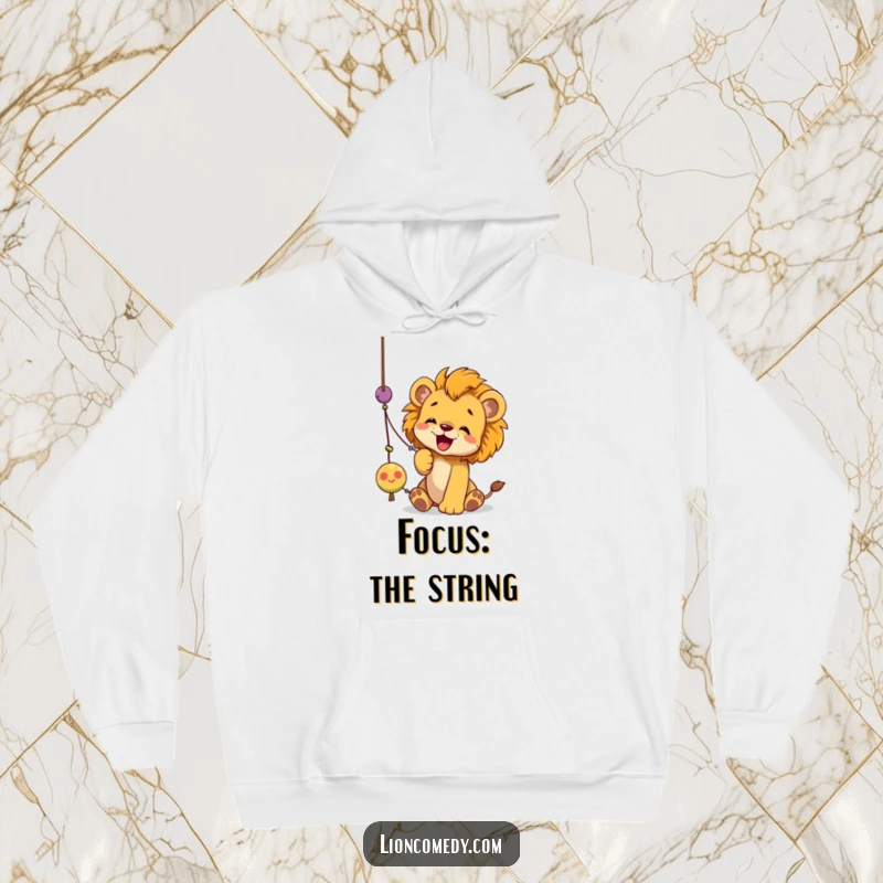 Funny lion cub hoodie showing a cute cub batting energetically at a dangling string toy with its paws outstretched.