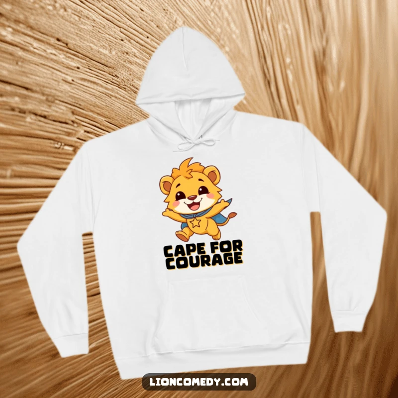 Funny hoodie depicting a smiling lion cub, clad in a superhero cape, soaring joyfully through the air.