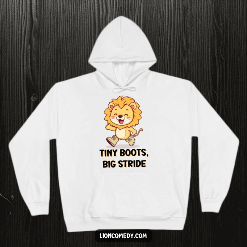 Funny kawaii lion wearing tiny boots, marching with exaggerated enthusiasm, a playful and determined character on a cozy hoodie.