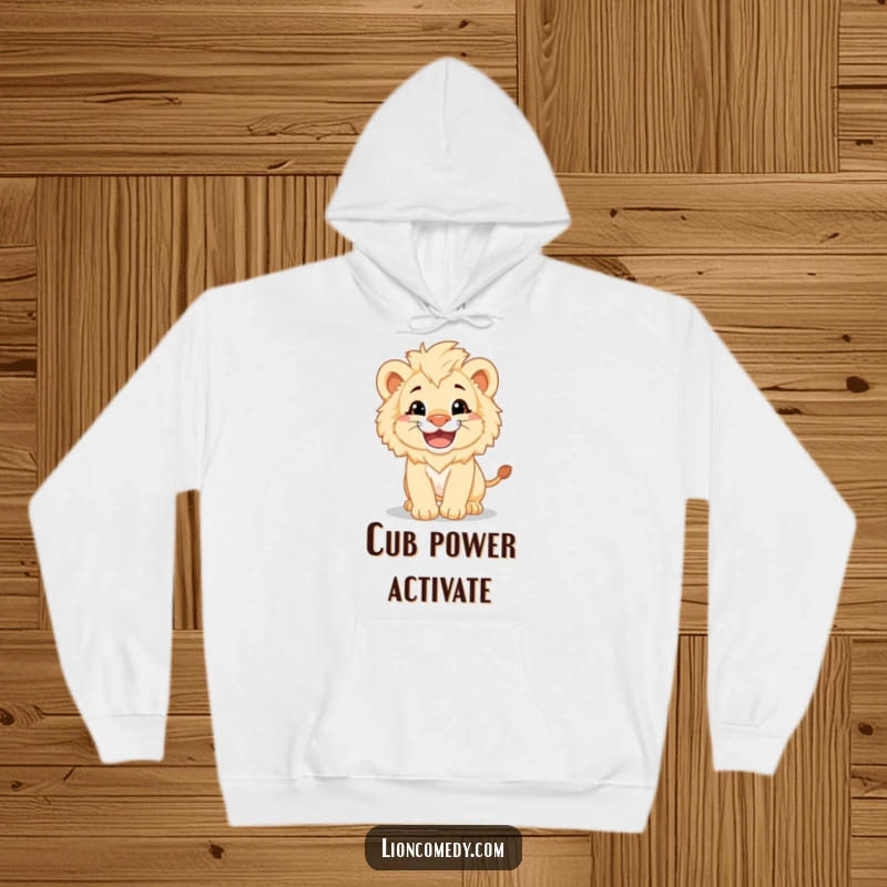 A cozy hoodie featuring a fluffy lion cub with a big grin, pouncing playfully, radiating adorable energy.