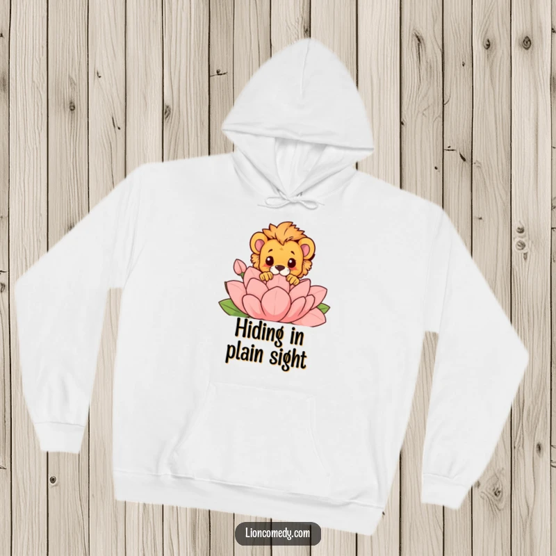 Funny hoodie with a lion cub peeking comically over a large, stylized flower, offering warmth and a dose of playful humor.