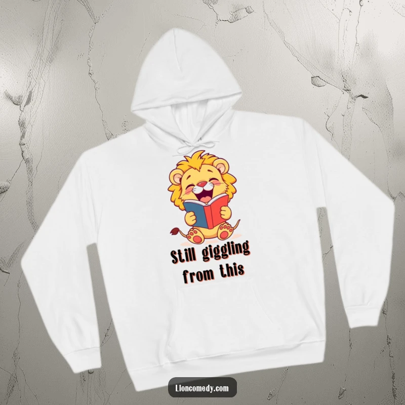 Funny Lion Cub Hoodie: A jovial cub holds a joke book and roars with laughter, spreading comedic cheer.