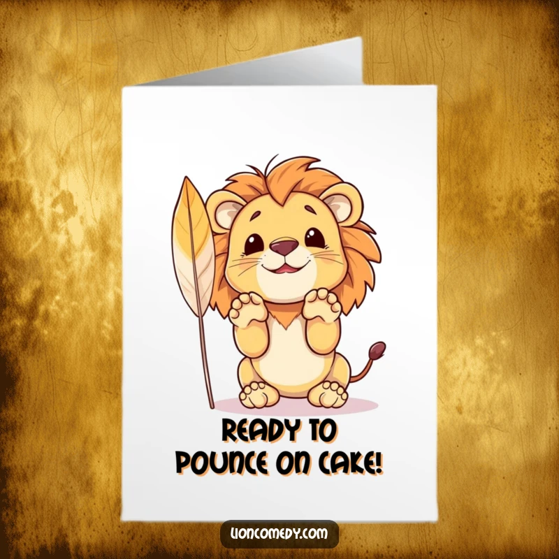 Funny free printable birthday card featuring a cartoon lion cub with paws raised, ready to pounce on a feather.