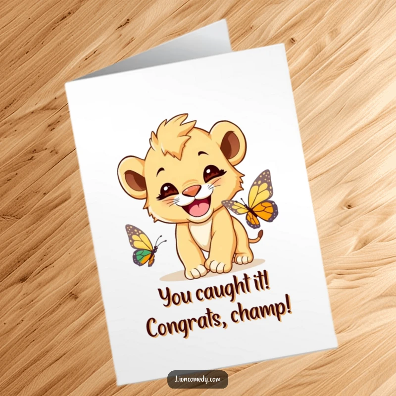 Funny Free Printable Congrats Card: A cute lion cub with a wide, happy grin, mid-chase with a butterfly.