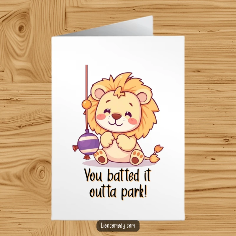 Funny Free Printable Congratulations Card featuring a kawaii lion batting playfully at a dangling string toy with its cute paws.