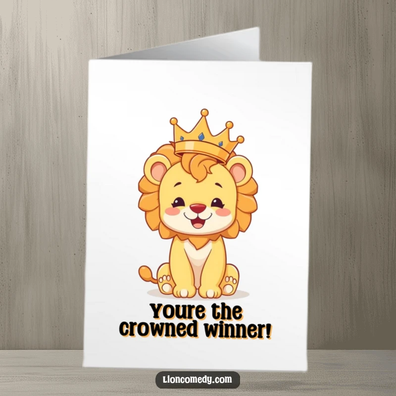 Funny Free Printable Congratulations Card: a happy lion cub precariously balances a crown, signifying a crowned success.