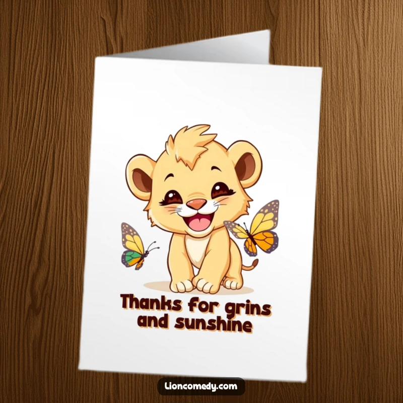 Funny Free Printable Thank You Card: A cute lion cub with a wide grin, looking delighted by a butterfly.