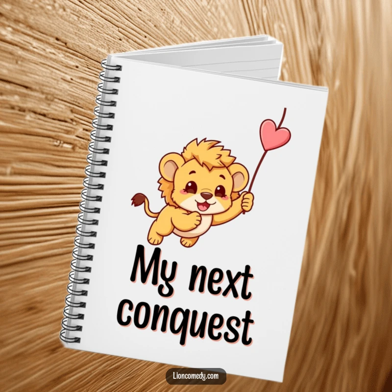 Funny notebook with a kawaii lion cub playfully pouncing on a dangling string, perfect for jotting notes.
