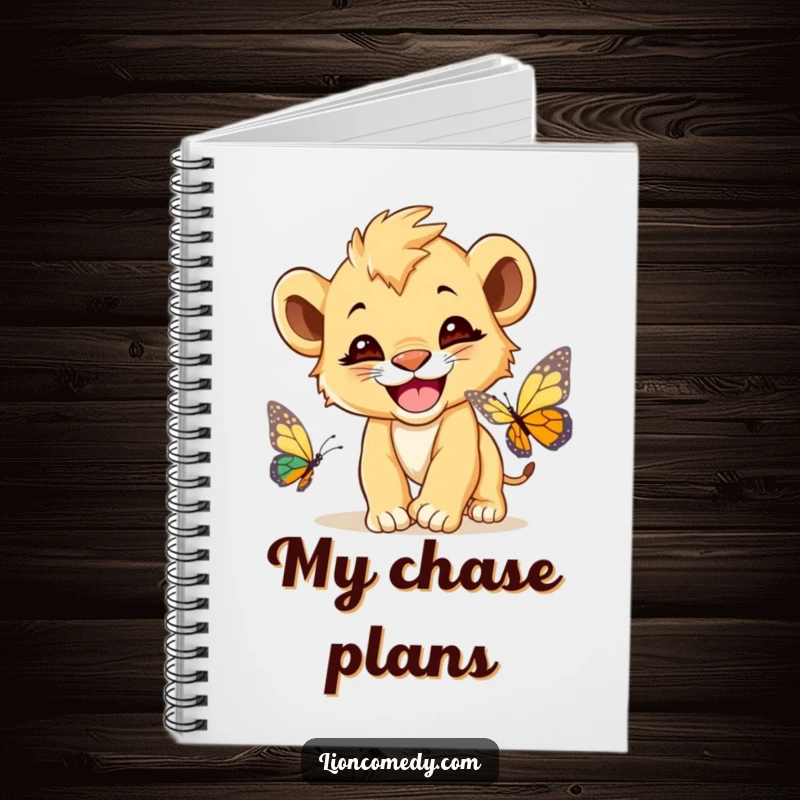 Funny Lion Cub Butterfly Notebook, a cute lion cub with a wide grin, chasing a butterfly, perfect for notes.