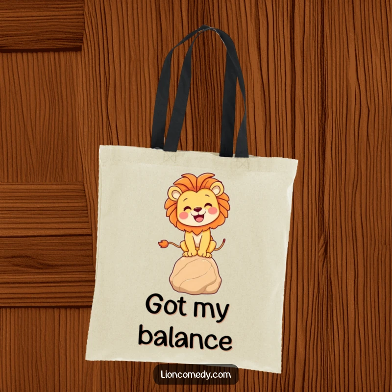 Funny lion balancing tote bag featuring a joyful lion on a rock, ideal for carrying essentials with a humorous and stylish flair.