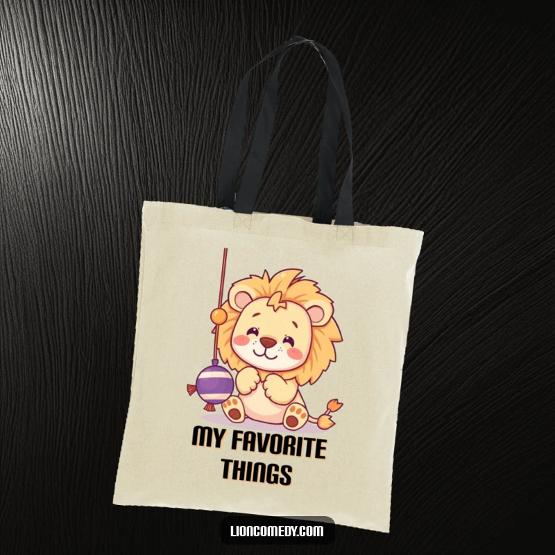 Funny tote bag featuring a kawaii lion batting at a dangling string toy with playful paws.